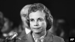 FILE - Judge Sandra Day O'Connor, smiles as she arrives for the start of her confirmation hearings before the Senate Judiciary Committee in Capitol Hill in Washington for the post of Supreme Court Associate Justice, Sept. 9, 1981