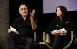 FILE - John Cooper, left, director of the Sundance Film Festival, and Kim Yutani, the festival's director of programming, take part in the opening day press conference at the 2019 Sundance Film Festival, Jan. 24, 2019, in Park City, Utah.