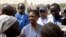 United Nations Under-Secretary-General for Humanitarian Affairs and Emergency Relief Coordinator for South Sudan, Valerie Amos, engages with local government officials and humanitarian aid workers in the village of Walgak, South Sudan on Thursday, Feb. 2,