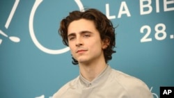 Actor Timothee Chalamet poses for photographers at the photo call for the film 'The King' at the 76th edition of the Venice Film Festival in Venice, Italy, Sept. 2, 2019.