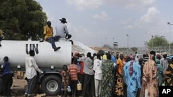 Residents gather outside UNMIS sector headquarters in Kadugli town, Sudan, June 9, 2011.