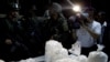 A members of the press photographs packages of seized cocaine during a drug presentation by police in Puerto Gaitan, some 150 miles southeast of Bogota, Colombia, Oct. 13, 2011.