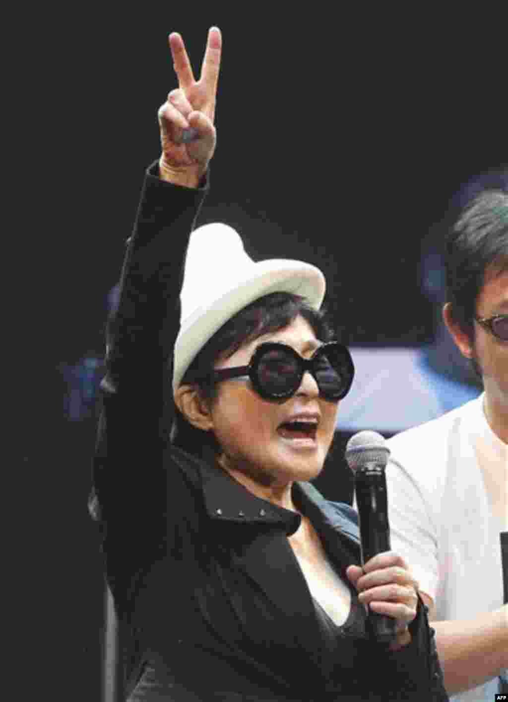 Yoko Ono performs during the Dream Power John Lennon Super Live concert at the Nippon Budokan in Tokyo, Wednesday, Dec. 8, 2010. Wednesday marks the 30th anniversary of the death of her husband John Lennon, (AP Photo/Shizuo Kambayashi)