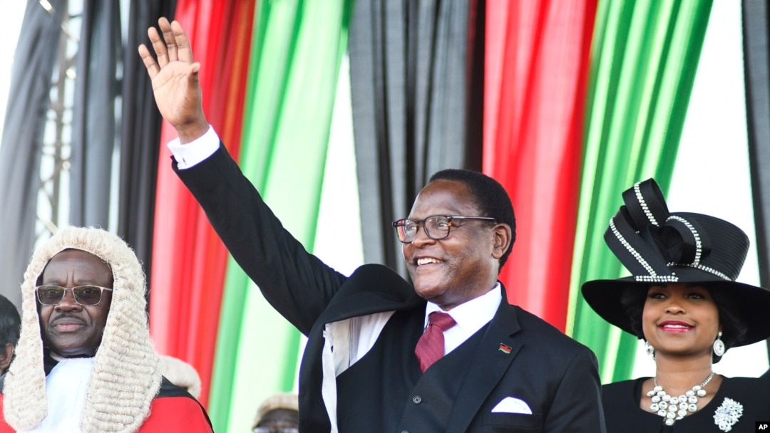 FILE - Malawi's newly elected President Lazarus Chakwera greets supporters after being sworn in in Lilongwe, Malawi, June 28 2020. 