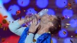 Mans Zelmerlow representing Sweden celebrates kissing the trophy after winning the final of the Eurovision Song Contest in Austria&#39;s capital Vienna.