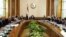 In this image released by the Egyptian Presidency, President Mohammed Morsi, center, meets with his Cabinet including new ministers at the presidential palace in Cairo, January 6, 2013.