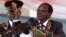 Zimbabwe's President Robert Mugabe addresses the crowd gathered to commemorate Heroes Day, in Harare, Zimbabwe, Aug. 12, 2013.