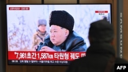 A man watches a television screen showing news footage of North Korea's leader Kim Jong Un observing a test-launch of strategic cruise missiles, at a train station in Seoul, South Korea, on Feb. 28, 2025. 