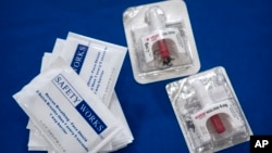 Containers of Narcan, a brand name version of the opioid overdose-reversal drug naloxone, sits on a table following a demonstration at the Health and Human Services Humphrey Building on Sept. 8, 2023, in Washington.