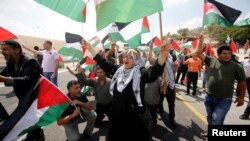 Palestinians take part in a protest against the planned Israeli demolition of the Bedouin village of Khan al-Ahmar, in the occupied West Bank, Sept. 7, 2018.