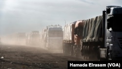 Trucks travel to deliver aid to Gaza, in Rafah, Egypt. (Hamada Elrasam/VOA) 