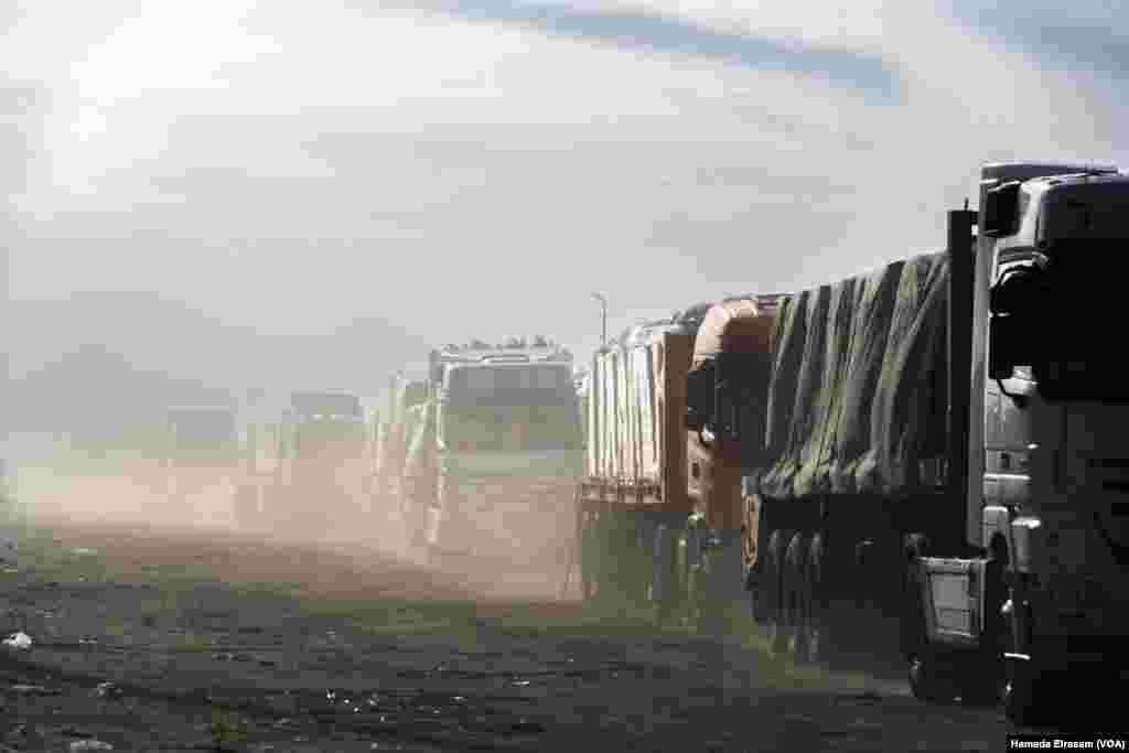 Trucks travel deliver aid in Rafah, Egypt. The first six weeks of the three-phase deal permit up to 600 truckloads of aid daily into Gaza, the prewar level of basic-needs support for survival, after averaging just 40 to 50 per day in recent months.