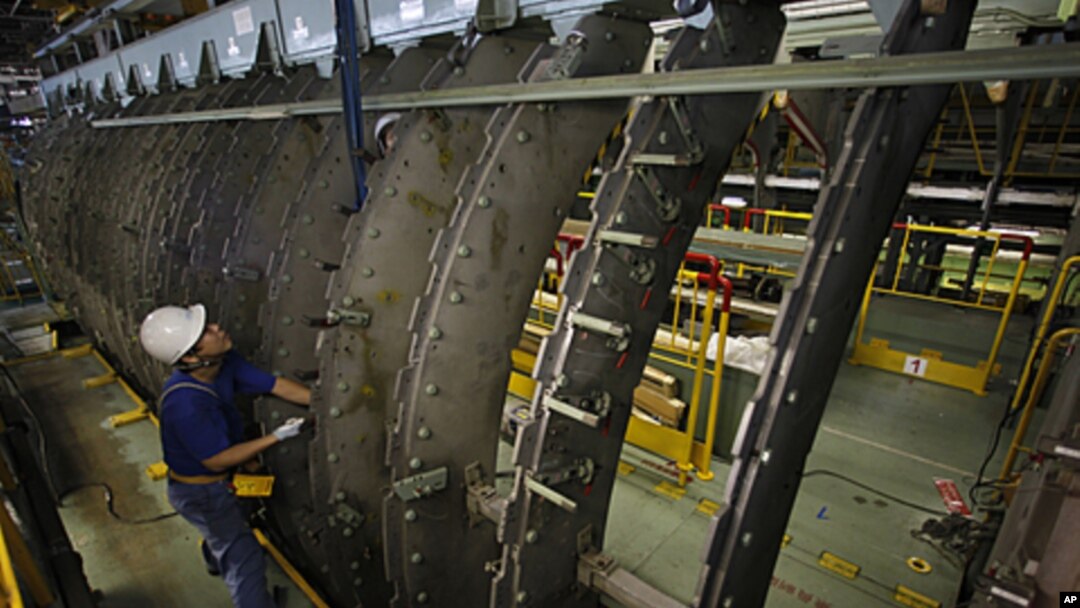 An employee works on a jig for a Boeing 767 at Mitsubishi Heavy Industries' Tobishima plant of its Nagoya Aerospace Systems Works in Nagoya, central Japan September 22, 2010.