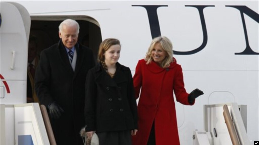 Vice President of the United States Joe Biden, left, granddaughter Finnegan and wife Jill, right, arrive at Vnukovo airport outside Moscow, Russia, March 8, 2011