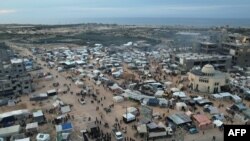 FILE - An aerial picture shows displaced Palestinians who fled Khan Yunis setting up camp in Rafah further south near the Gaza Strip's border with Egypt, on December 7, 2023, amid continuing battles between Israel and Hamas.