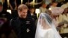 Prince Harry looks at his bride, Meghan Markle, as she arrives accompanied by the Prince of Wales in St George's Chapel at Windsor Castle for their wedding in Windsor, Britain, May 19, 2018.