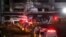 Ambulances are parked outside a damaged warehouse which is currently under construction, after it caught fire, in Icheon, South Korea, April 29, 2020.