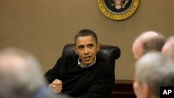 President Barack Obama is briefed on the events in Egypt during a meeting with his national security team in the Situation Room of the White House.