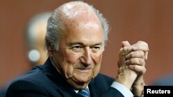 FILE: FIFA President Sepp Blatter gestures after he was re-elected at the 65th FIFA Congress in Zurich, Switzerland, May 29, 2015.