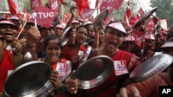 Demonstrators shout slogans as they hold steel plates during a rally to protest food prices in New Delhi February 23, 2011.