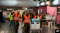 Hospital staff and soldiers move patients and equipment to the underground ward at Rambam medical center as fighting escalates between Israel and the Lebanese militant group Hezbollah. in Haifa, Israel, Sept. 22, 2024. 