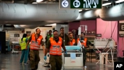 Hospital staff and soldiers move patients and equipment to the underground ward at Rambam medical center as fighting escalates between Israel and the Lebanese militant group Hezbollah. in Haifa, Israel, Sept. 22, 2024.