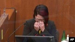 In this image from video, witness Courteney Ross tears up as she answers questions at the trial of former Minneapolis police officer Derek Chauvin, at the Hennepin County Courthouse in Minneapolis, Minnesota, April 1, 2021.
