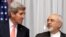 U.S. Secretary of State John Kerry, left, and Iran's Foreign Minister Mohammad Javad Zarif are seen before resuming talks over Iran's nuclear programme in Lausanne, Switzerland, March 16, 2015. 