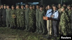 Colombia's President Juan Manuel Santos (2nd R) speaks after a meeting with military high command officers.