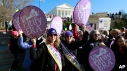 FILE - In this Jan. 8, 2020, file photo, Equal Rights Amendment supporters demonstrate outside Virginia State Capitol in Richmond, Va. 