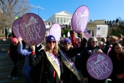 FILE - In this Jan. 8, 2020, file photo, Equal Rights Amendment supporters demonstrate outside Virginia State Capitol in Richmond, Va.