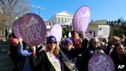 FILE - In this Jan. 8, 2020, file photo, Equal Rights Amendment supporters demonstrate outside Virginia State Capitol in Richmond, Va. 