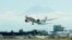 The first scheduled Boeing 787 airplane to depart from Seattle-Tacoma International Airport, takes off October 2, 2012.