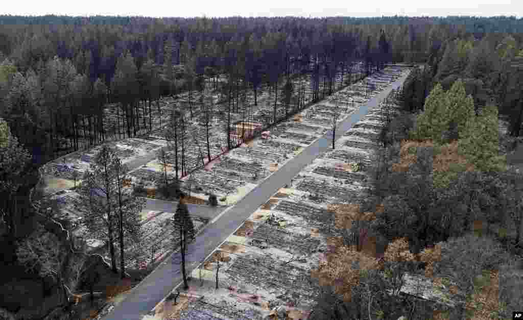 FILE- Homes were leveled by the Camp Fire line the Ridgewood Mobile Home Park retirement community in Paradise, Calif., Dec. 3, 2018.