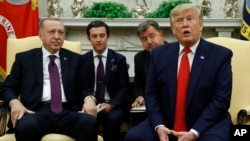 President Donald Trump and Turkish President Recep Tayyip Erdogan meet in the Oval Office with Republican senators at the White House, Nov. 13, 2019, in Washington. 
