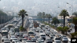 FILE - Vehicles jam a road in Algiers, Algeria, Sept. 29, 2010. Leaded gasoline has finally reached the end of the road, the United Nations environment office said Aug. 30, 2021, after the last country in the world to use it stopped selling the fuel.