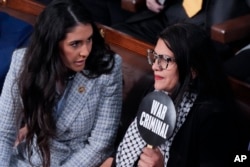 FILE - Rep. Anna Paulina Luna, R-Fla., talks to Rep. Rashida Tlaib, D-Mich., holding a sign, during a speech by Israel's prime minister in Washington, July 24, 2024. Arab, Palestinian and Muslim groups have protested U.S. support for Israel in the war against Hamas.