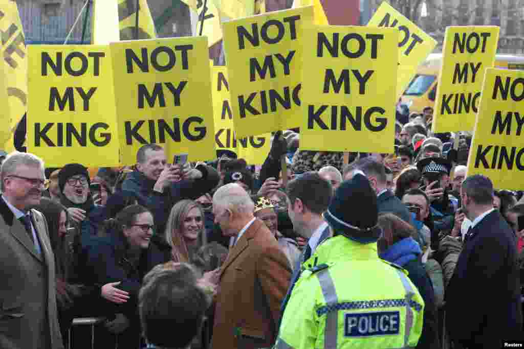 Britain&#39;s King Charles interacts with well-wishers as anti-monarchy demonstrators display, &quot;Not my king&quot;, posters, during a visit to Middlesbrough.