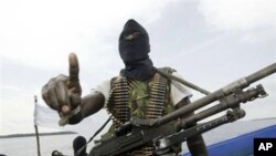 Militants patrol the creeks of the Niger Delta area, Nigeria (2006 file photo)