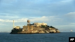 Alcatraz Island is shown in San Francisco, Oct. 22, 2001. The cellhouse is shown in the background up on the hill next to the water tower, and in the foreground is the model industries building where the prisoners washed clothes, among other tasks.