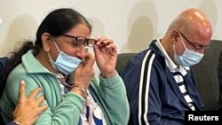 Karishma Shahani reacts at a news conference while discussing her daughter Bharti Shahani, a 22-year-old college student, who was declared dead from injuries received in a stampede at the 2021 Astroworld Festival in Houston, Texas, Nov. 11, 2021.
