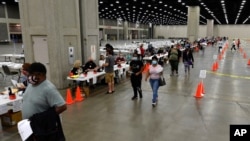 Voters head to the designated area to fill out their ballots in the kentucky primary at the Kentucky Exposition Center in Louisville, Ky., June 23, 2020. 