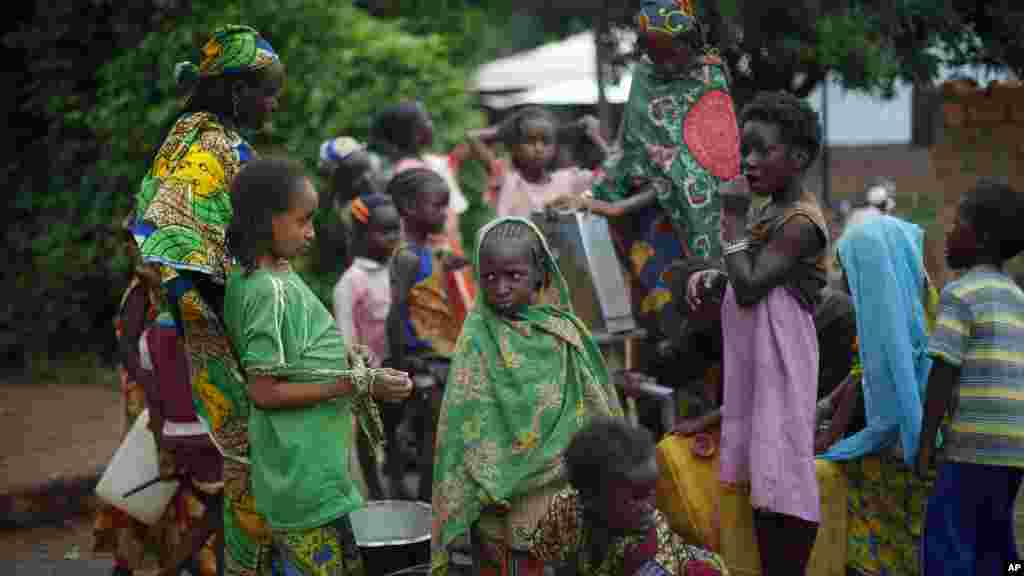 Muslim children gather at a water pump outside the mosque at PK12 in Bangui, Central African Republic, April 10, 2014.