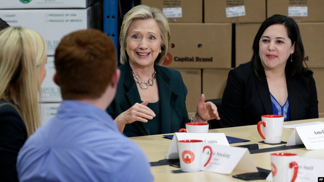 Democratic presidential candidate Hillary Rodham Clinton, center, speaks during a small business roundtable, April 15, 2015, in Norwalk, Iowa.