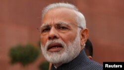 FILE - India's Prime Minister Narendra Modi speaks to the media inside the parliament premises in New Delhi, Nov. 16, 2016.