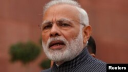 FILE - India's Prime Minister Narendra Modi speaks to the media inside the parliament premises in New Delhi, Nov. 16, 2016.