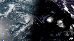 Gambar satelit yang disediakan oleh National Oceanic and Atmospheric Administration (NOAA) memperlihatkan Badai Tropis Hone dan Badai Gilma di tenggara Hawaii pada Jumat, 22 Agustus 2024. (NOAA via AP)