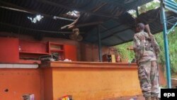FILE: Fourteen Malian soldiers were killed in a clash with jihadists this week, the army said Thursday, giving a new toll.
