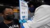 A nurse injects a man with a dose of the Moderna COVID-19 vaccine at an open vaccination site at Jackson State University in Jackson, Miss., Aug. 3, 2021.