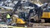 Emergency response workers dig through the rubble of the Mayfield Consumer Products candle factory in Mayfield, Kentucky, Dec. 11, 2021, after it was destroyed by a tornado.